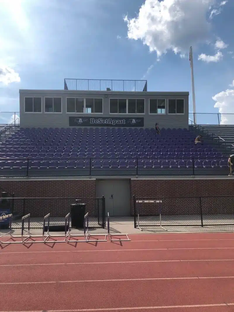 Blue and purple individual stadium seats installed in the Lipscomb Academy grandstand